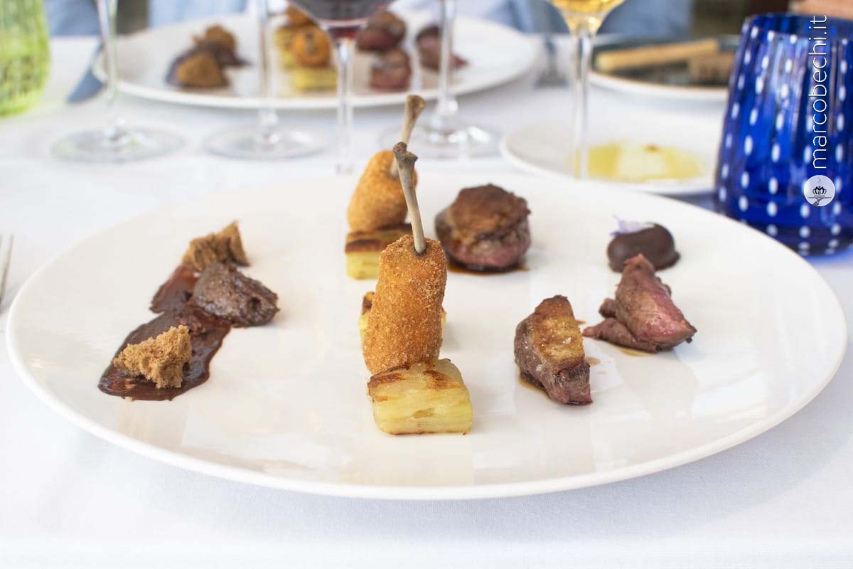 Piccione con prugne secche di Montalcino, cioccolato e patata fondente