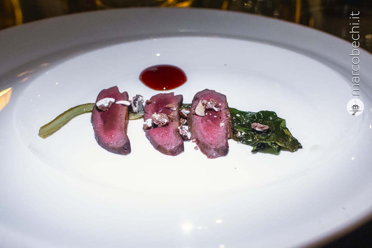 Petto e coscia di piccione, bietole, riduzione di Americano e salsa di cioccolato al balsamico